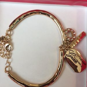 Golden bracelet with charms